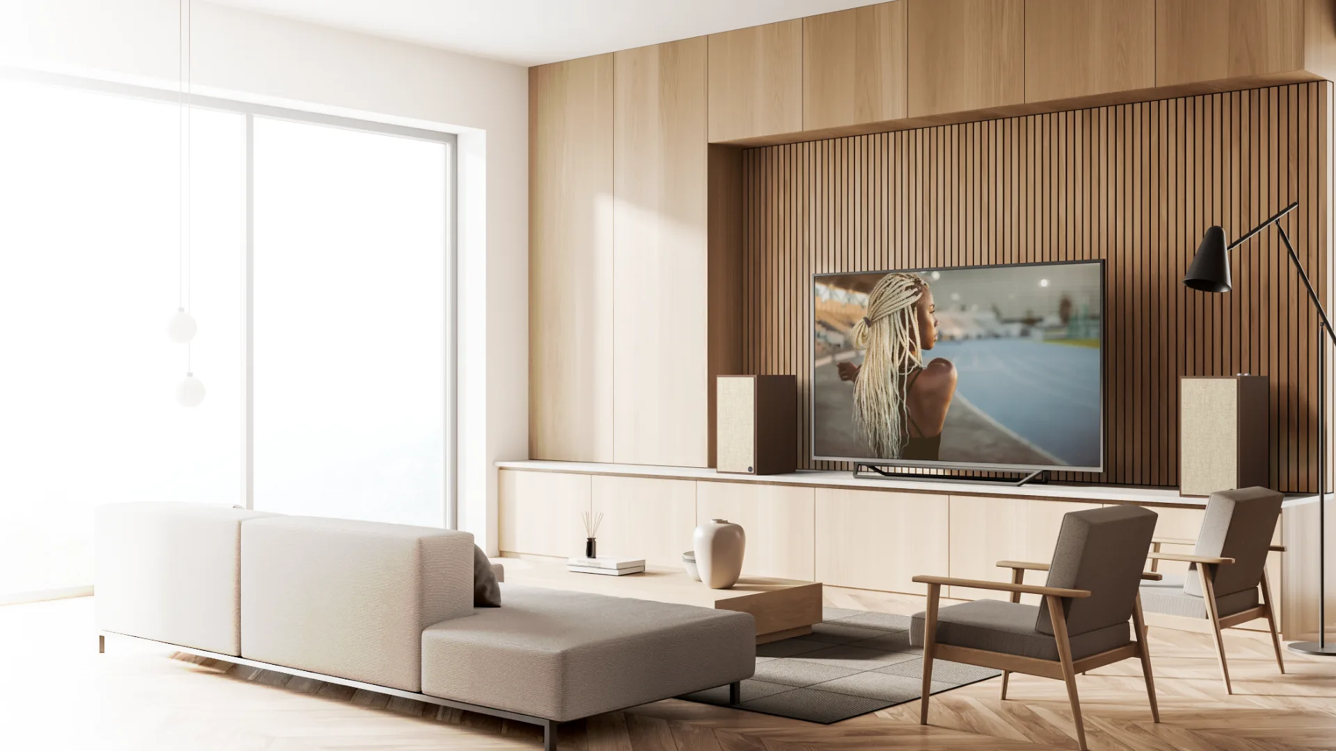 Parlantes activos Klipsch The Sevens junto al televisor en un living luminoso